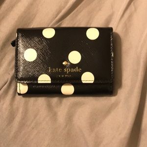 Black wallet with white polka dots